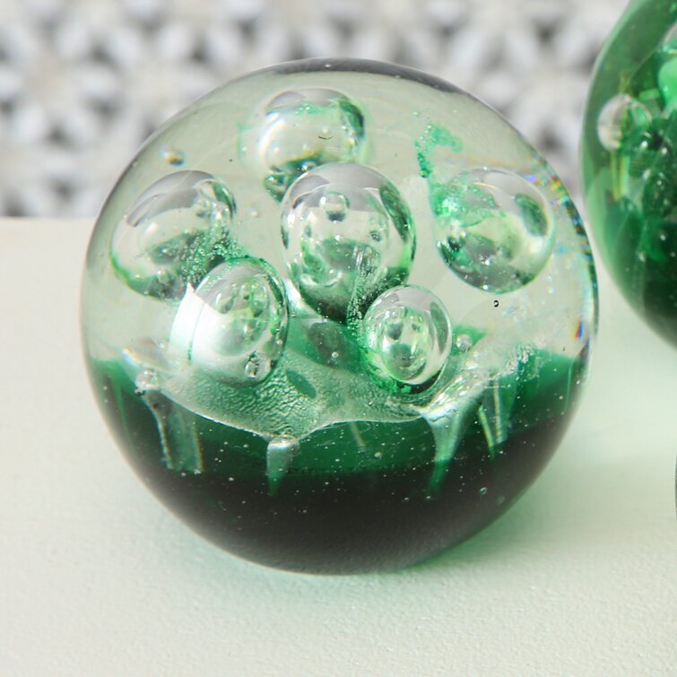 Handmade glass paperweight with controlled bubbles