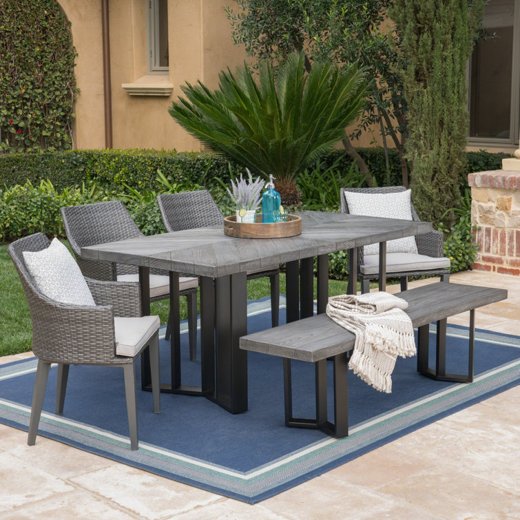 Delanne Rectangular 6 - Person 70'' Long Dining Set with Cushions