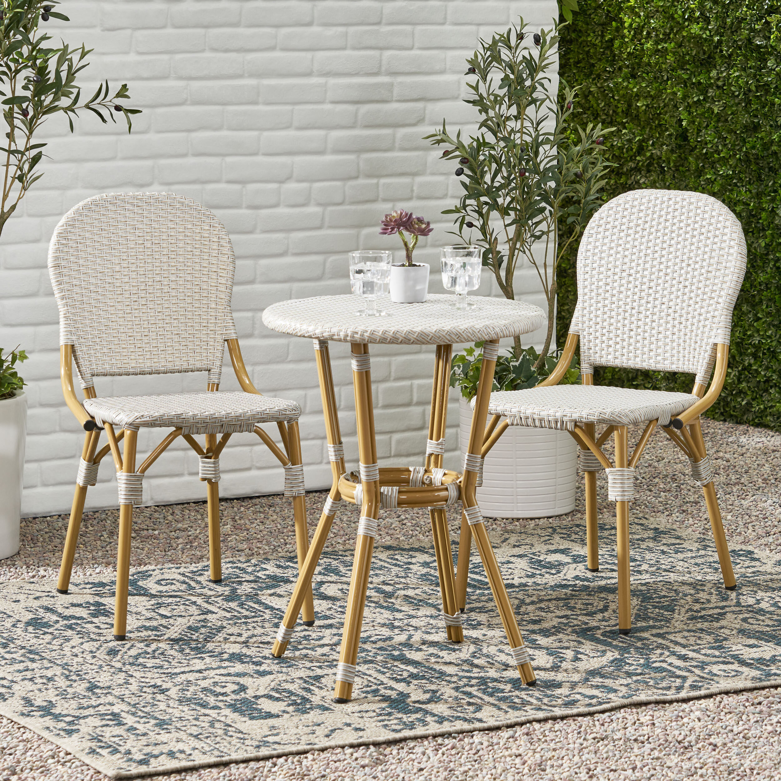 Image of Wicker bistro patio set with round table and two wicker chairs