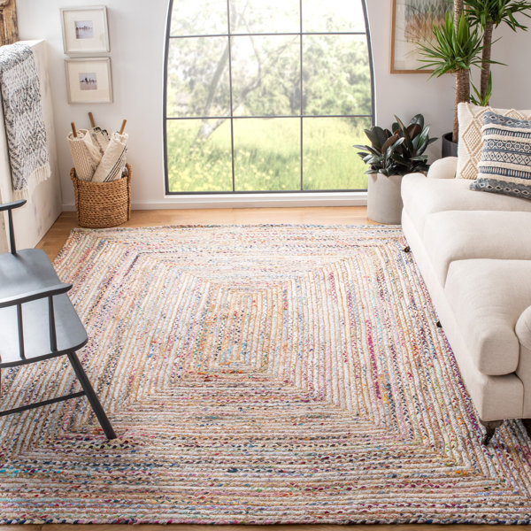 A cotton rug in a small living room.