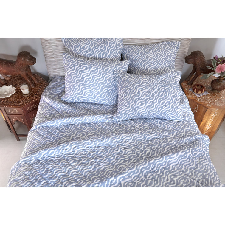 light blue and white quilt